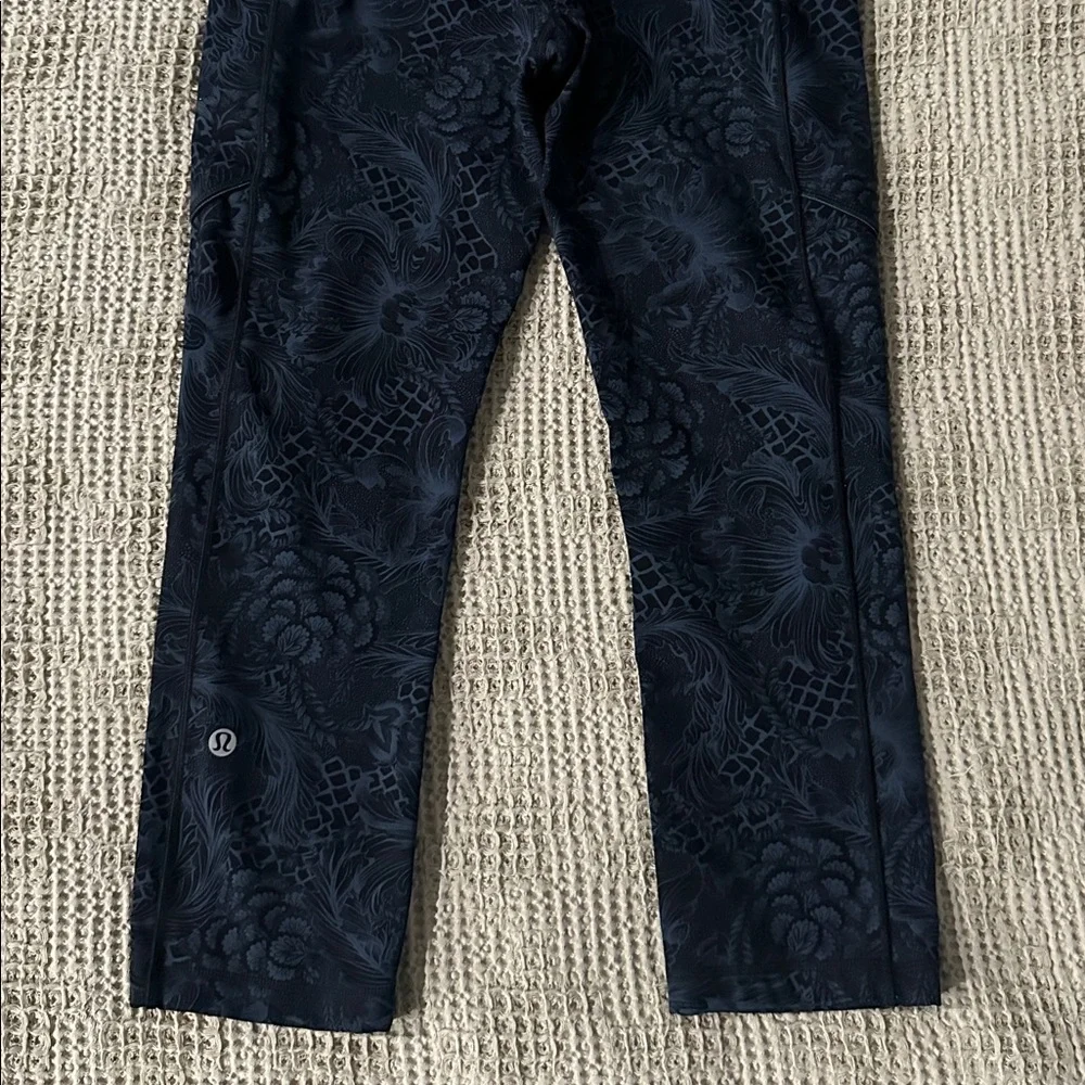 Lululemon black high-waisted leggings with floral pattern